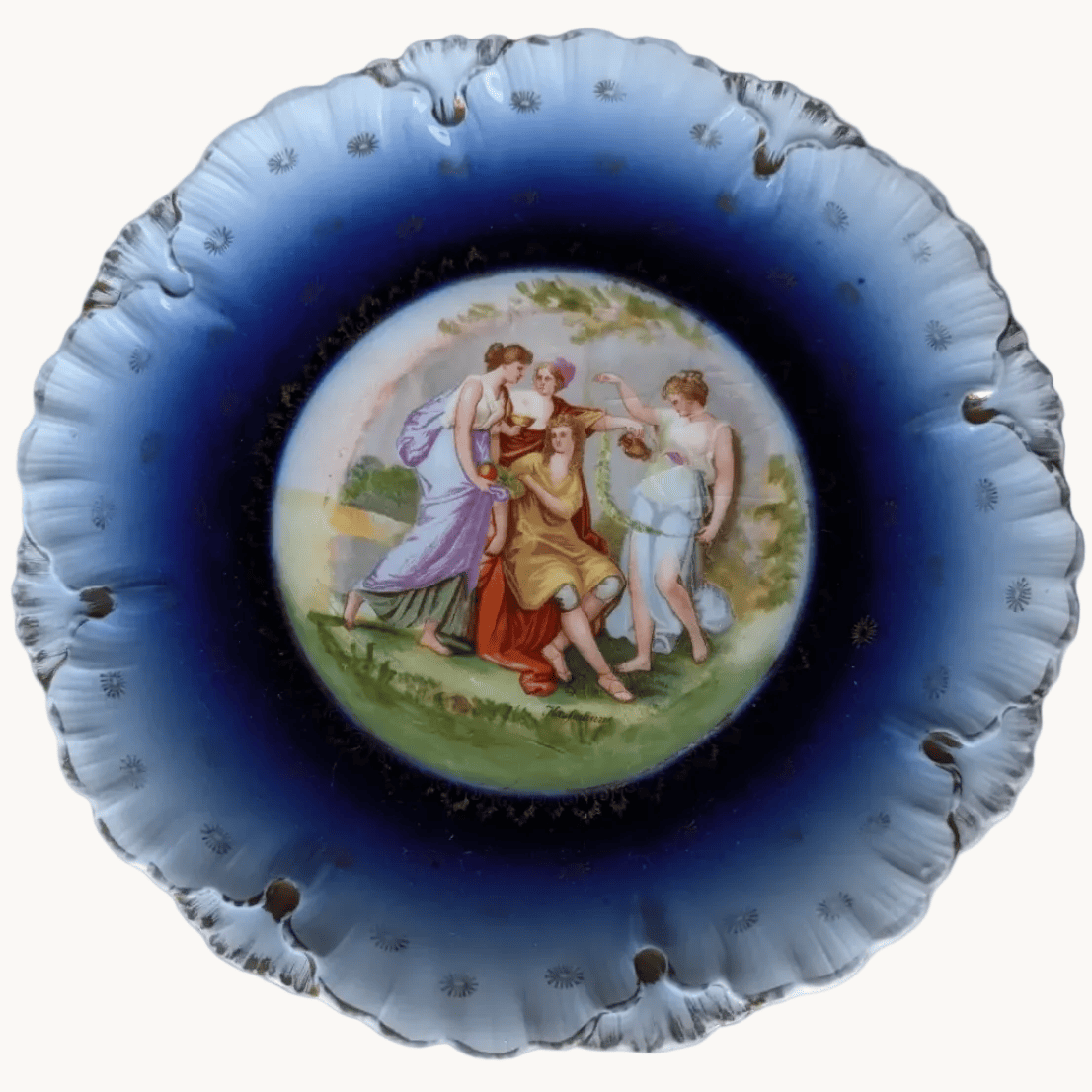 Antique cobalt blue porcelain plate with gold rim and painted cherubs, 23cm