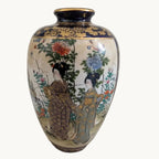 Hand-painted Satsuma-style vase with cobalt figures, florals, and gold rim