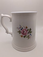 White bone china tankard mug with pink rose bouquet and blue/yellow wildflowers, side handle