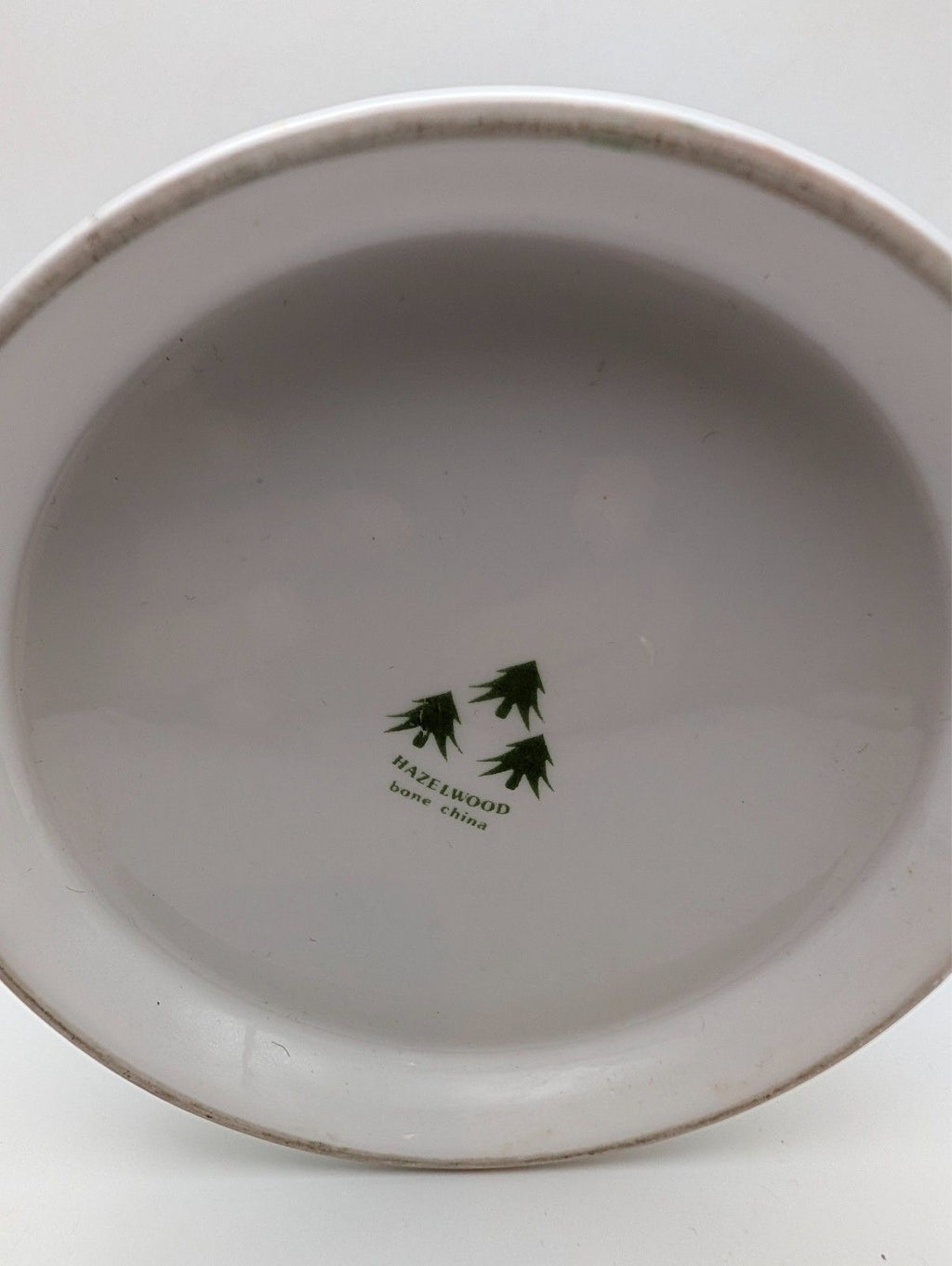 White mug base with green Hazelwood Fine China maker mark