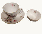 Floral bone china teacup, saucer and pin dish with gold rim detail