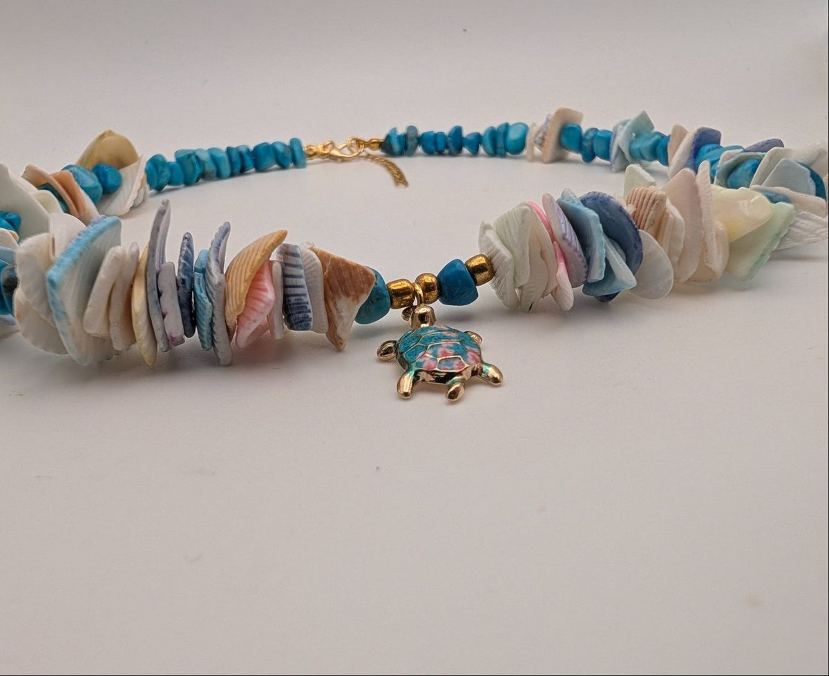 Turquoise and multicolor shell choker with turtle charm at center