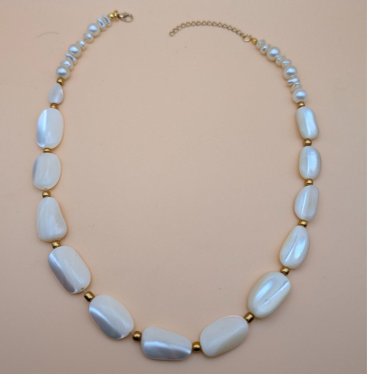 Light blue oval bead statement necklace with gold-tone accents