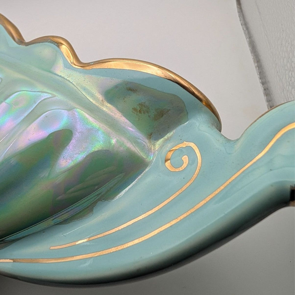 Iridescent oval centerpiece bowl with gold trim and twin handles, blue-green
