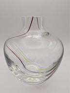 Clear glass bud vase with internal swirl, wide round body and narrow neck