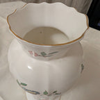 White fine bone china vase with scalloped rim and gold-toned inner edge