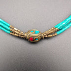 Turquoise multi-strand beaded choker with bronze medallion and turquoise accents