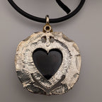 Black cord heart pendant necklace with textured silver winged heart charm