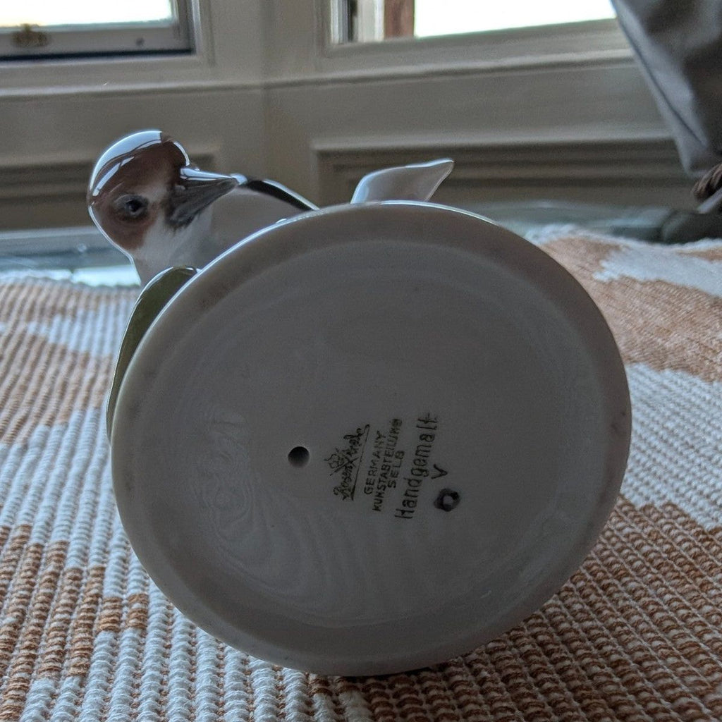 Porcelain woodpecker figurine underside base with maker mark, round