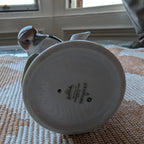 Porcelain woodpecker figurine underside base with maker mark, round