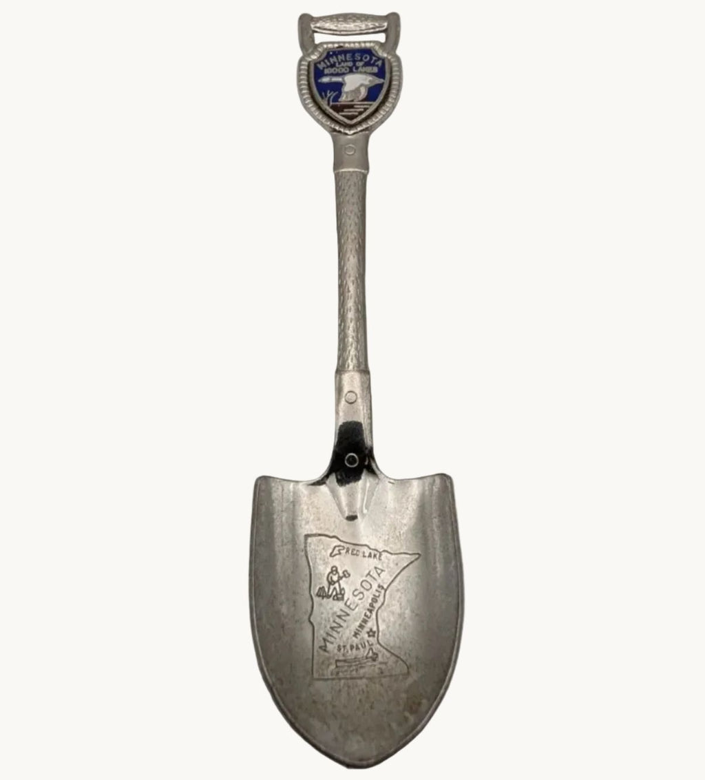 Shovel-shaped collector spoon with Minnesota loon and state map emblem, 1980