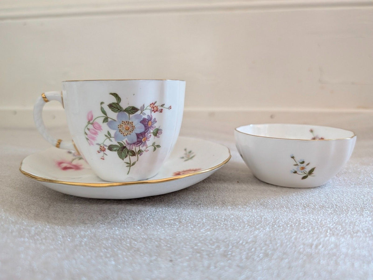 Bone china teacup and saucer with posies floral print and gold edge