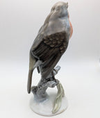 Hand-painted porcelain robin bird figurine side view, gray wings and orange chest on base