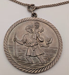 Sterling silver St Christopher pendant on oval textured bail and chain