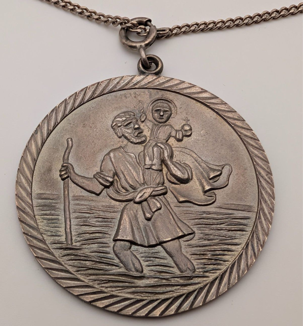 Sterling silver St Christopher pendant on oval textured bail and chain