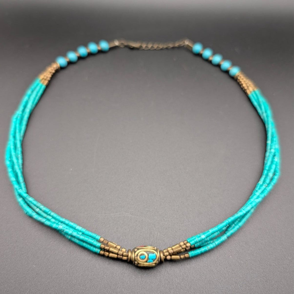 Turquoise multi-strand beaded choker with bronze spacer beads and central charm