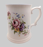 White floral bone china mug tankard with pink rose and blue flower design, curved handle