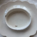 Cream porcelain base marked "195" inside, scalloped stand underside