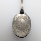 Souvenir collector spoon bowl with engraved Freedom Train scene and raised rim