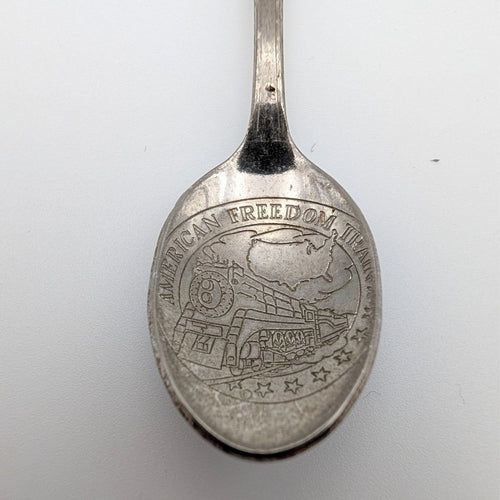 Souvenir collector spoon bowl with engraved Freedom Train scene and raised rim