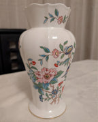 White fine bone china vase with bird-of-paradise and pink floral branches