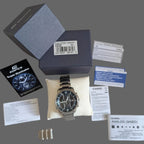Men's stainless steel chronograph watch with blue-accent black dial and bracelet