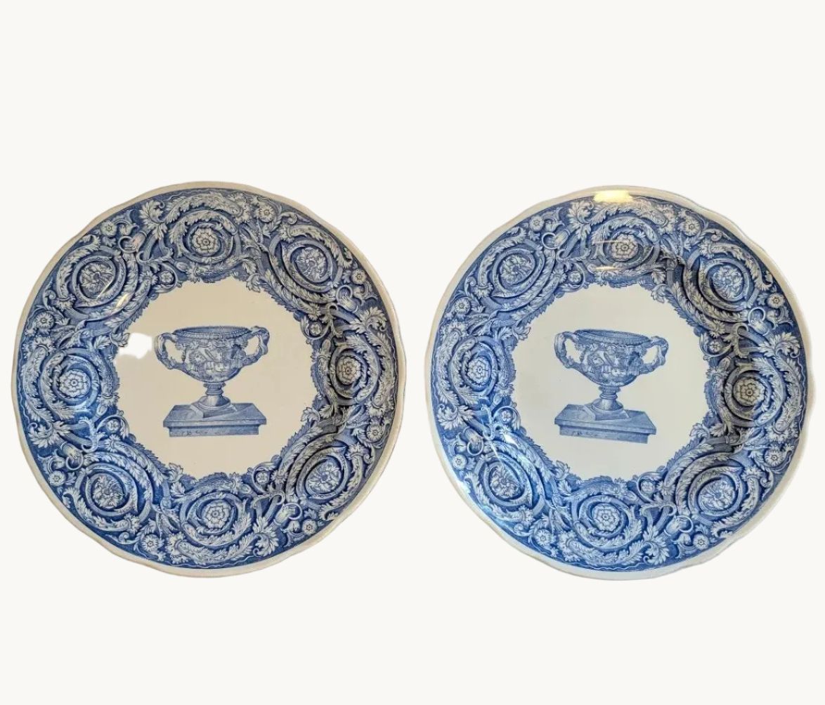 Pair of blue-and-white porcelain dinner plates, ornate urn border, 24 cm.