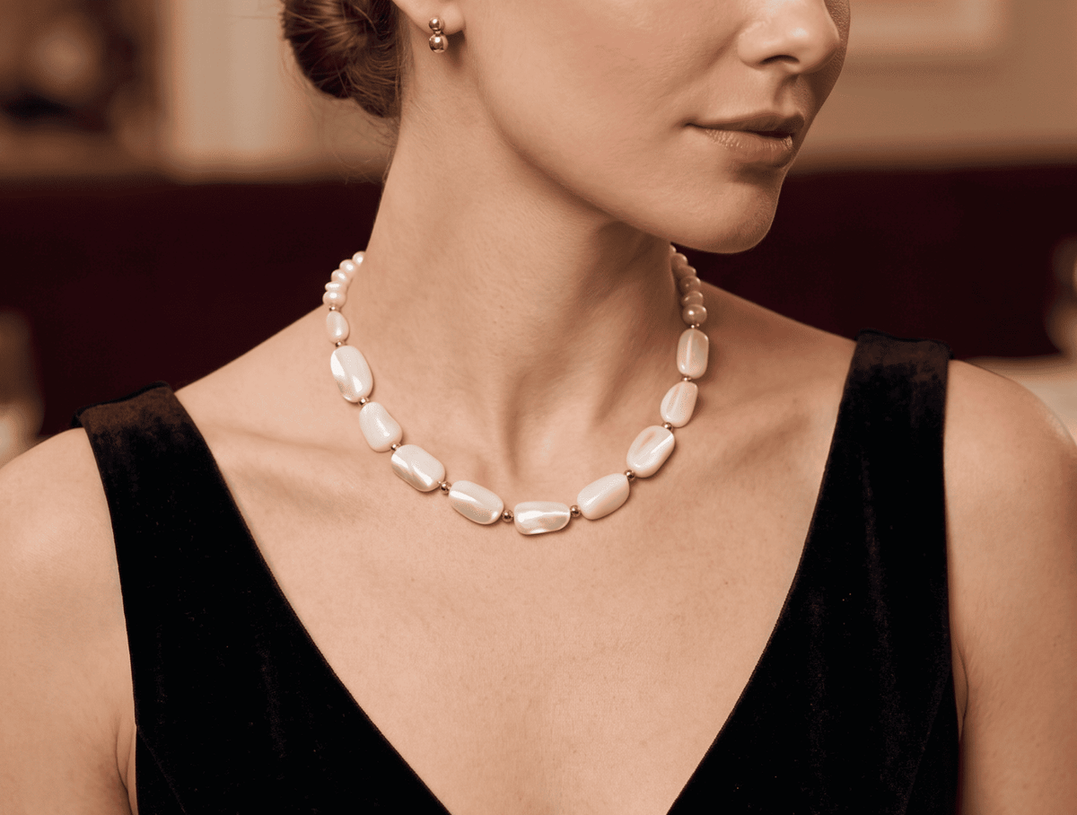 White pearl bead statement necklace with gold-tone links, oval beads