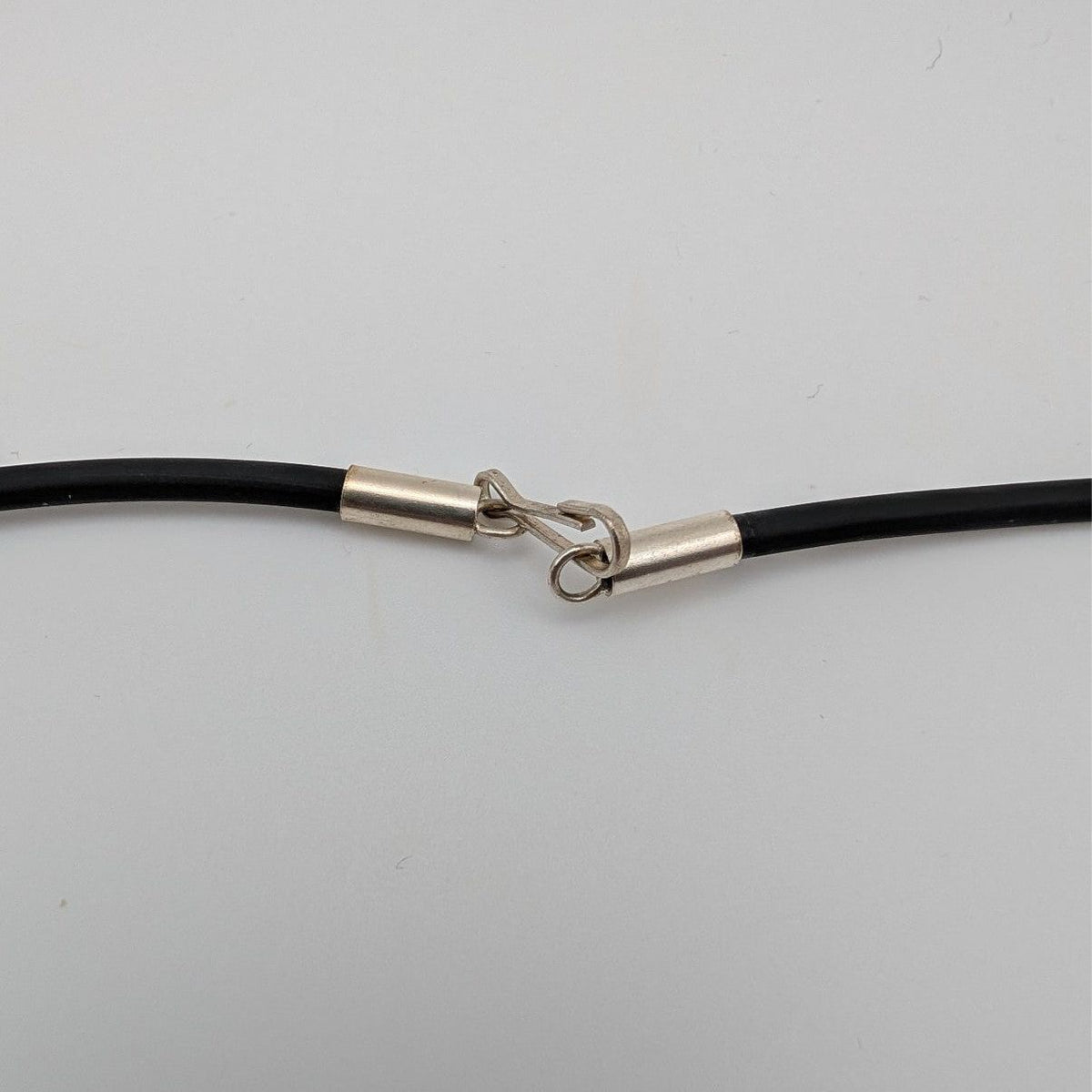 Black cord choker necklace with silver clasp and connector ring