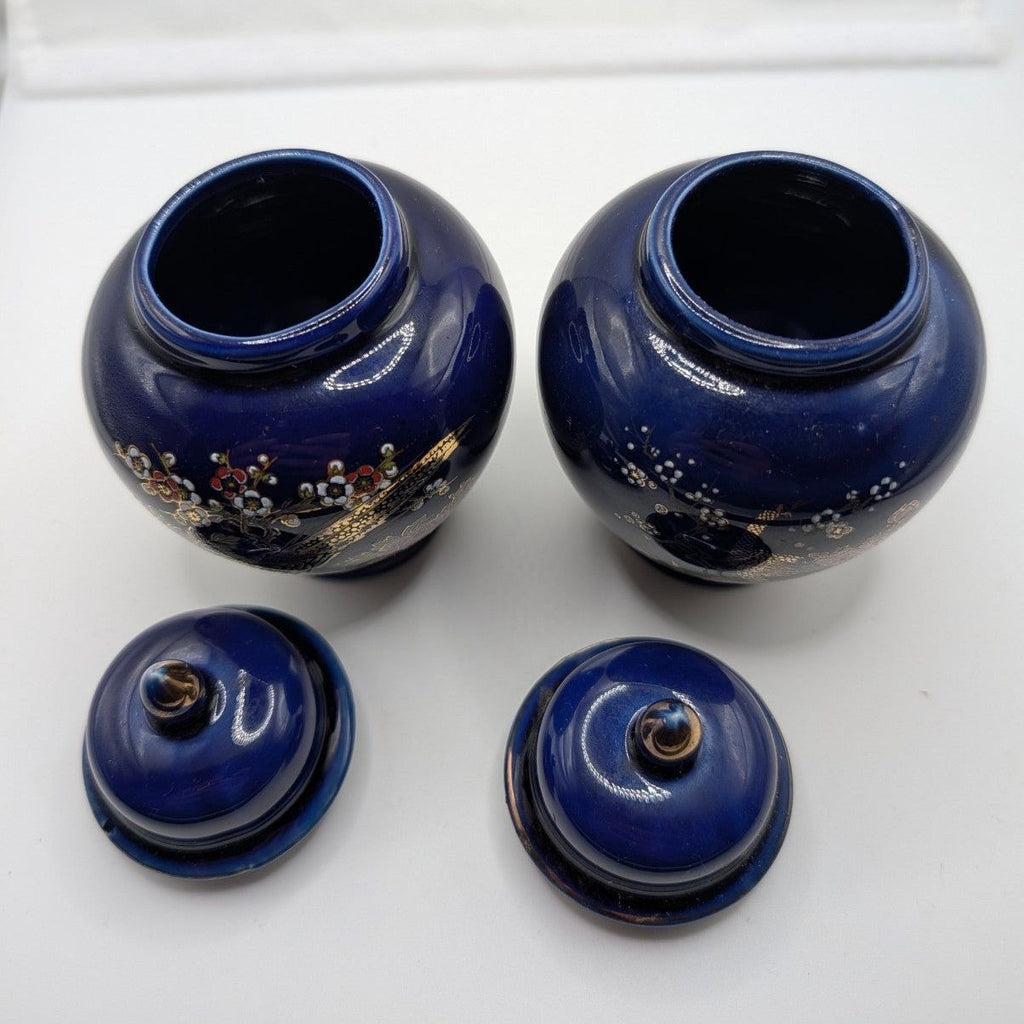 Set of cobalt blue ceramic ginger jars with matching lids, gold floral details
