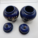 Set of cobalt blue ceramic ginger jars with matching lids, gold floral details