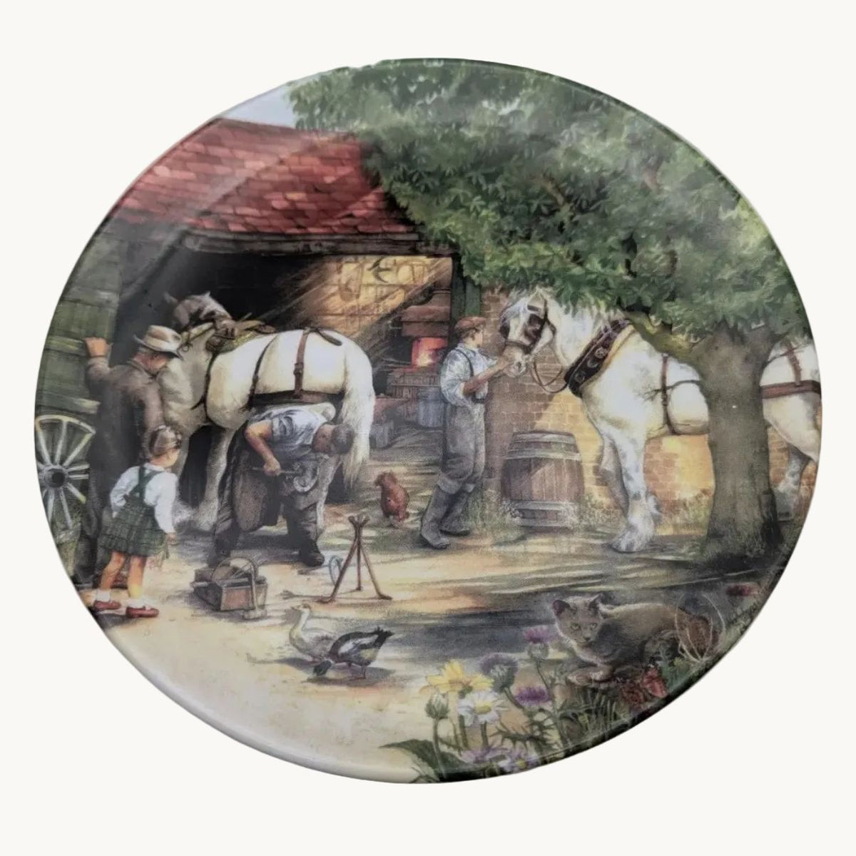 Decorative collector plate with blacksmith scene and floral border, round ceramic