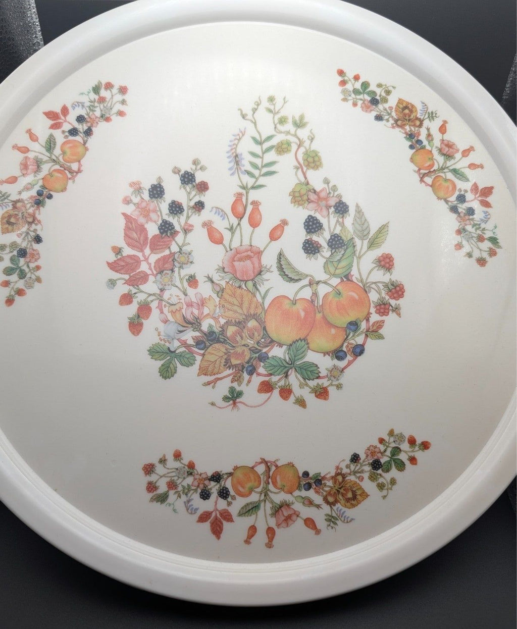 Round white melamine serving tray with fruit and flower wreaths, centered design