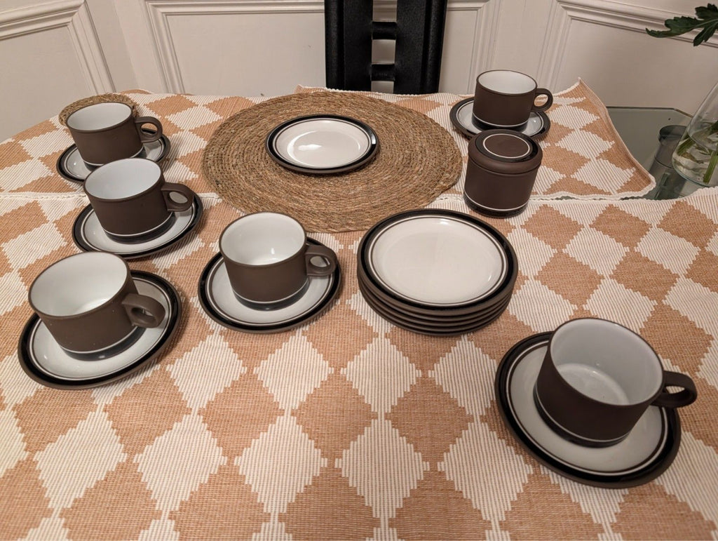 19-piece tea and coffee stoneware set with cups, saucers, and matching plates