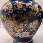Cobalt blue ceramic ginger jar lid with gold peacock and floral pattern