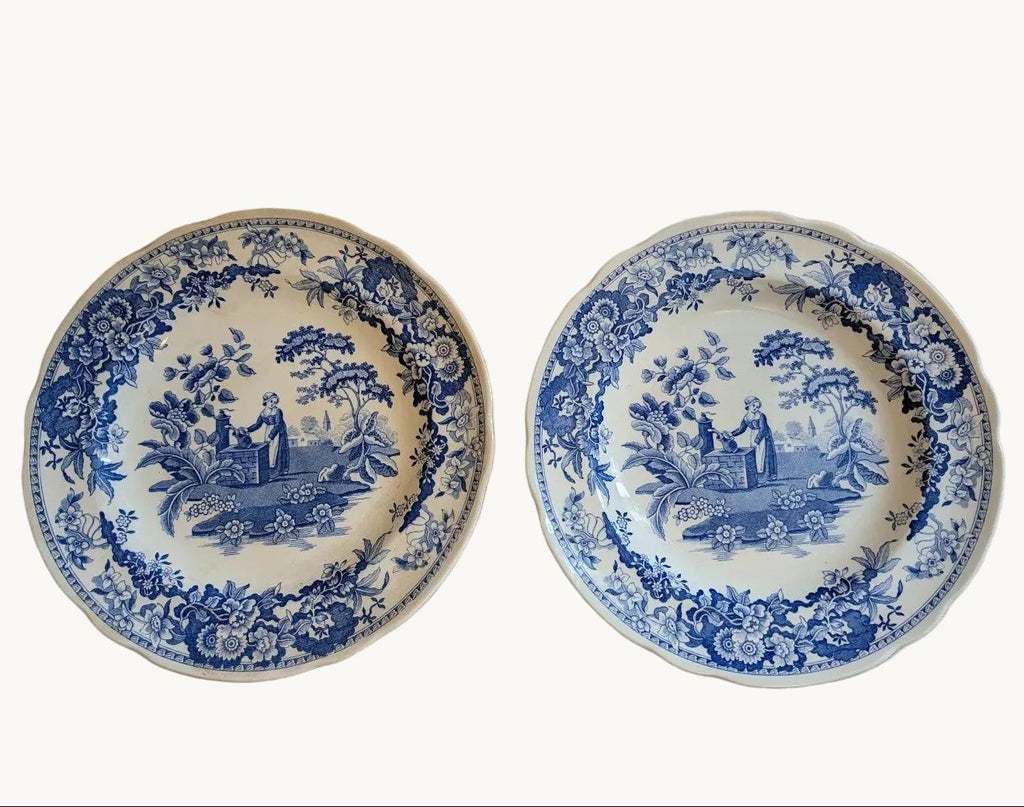 Pair of blue-and-white porcelain dinner plates, 24cm, with girl at well motif