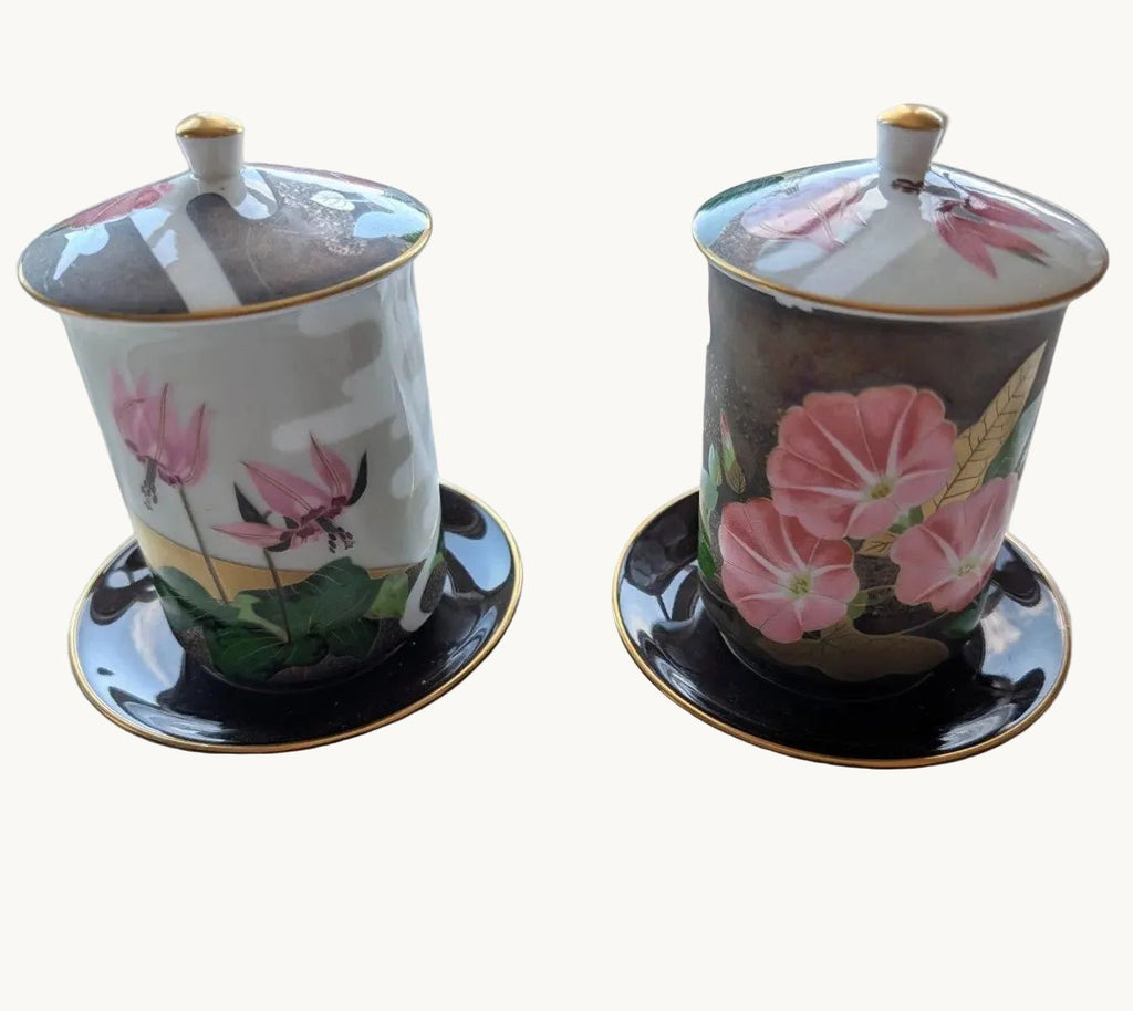 Pair of lidded yunomi tea cups with saucers, floral pink and white ceramic.