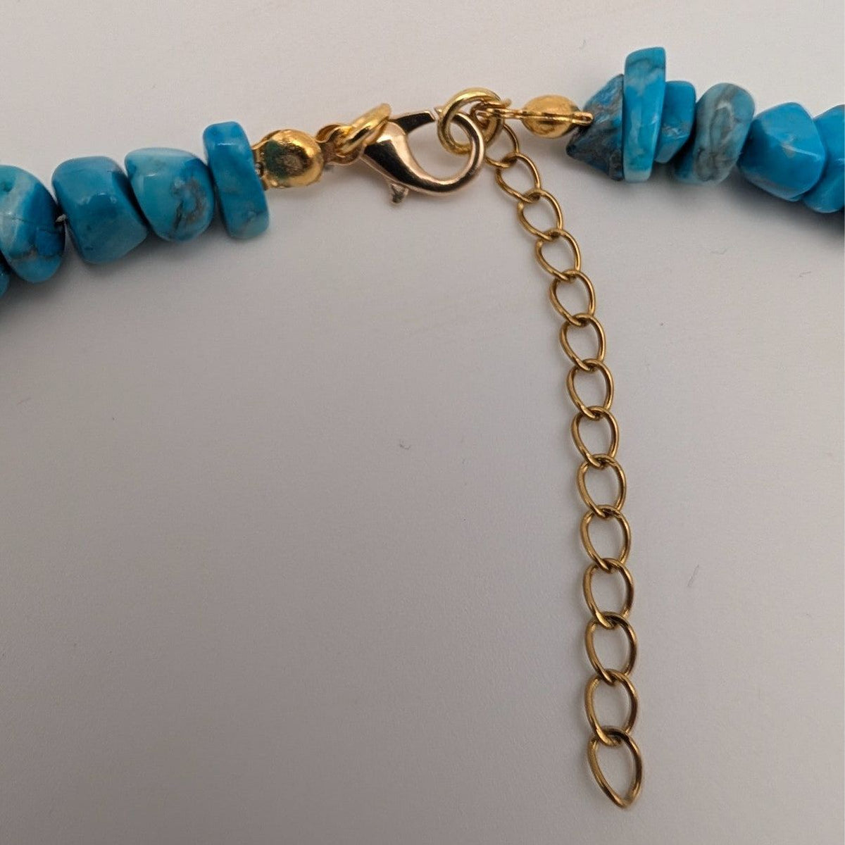 Turquoise bead choker with gold chain clasp and extender loop