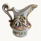 Ceramic jug vase with cherub putti relief, colorful scenes, gold gilt trim