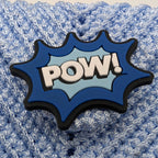 Light blue crochet phone bag with large POW comic-style patch on front