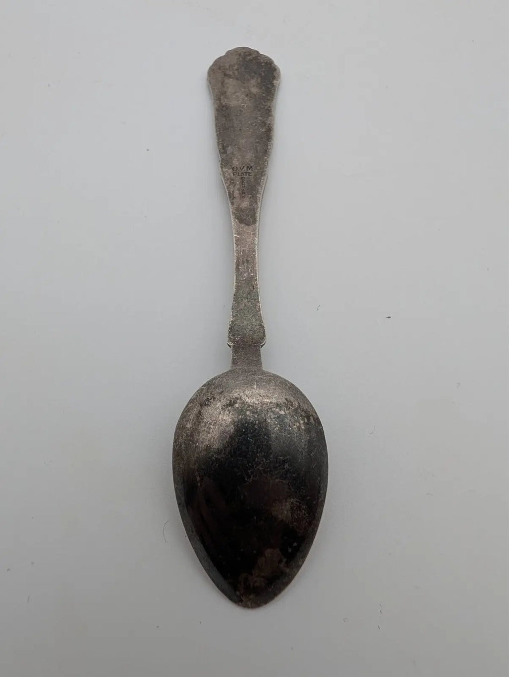 Silver-plated small spoon with rounded bowl and narrow stem