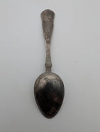 Silver-plated small spoon with rounded bowl and narrow stem