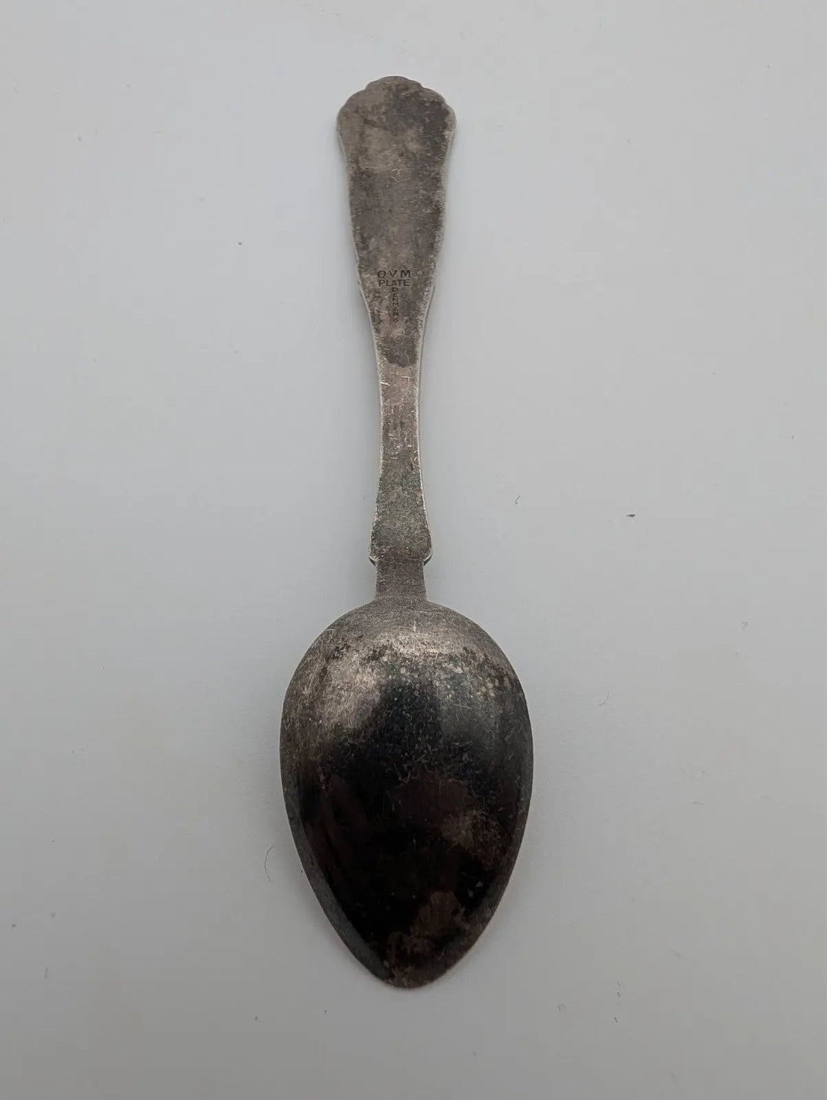Silver-plated small spoon with rounded bowl and narrow stem