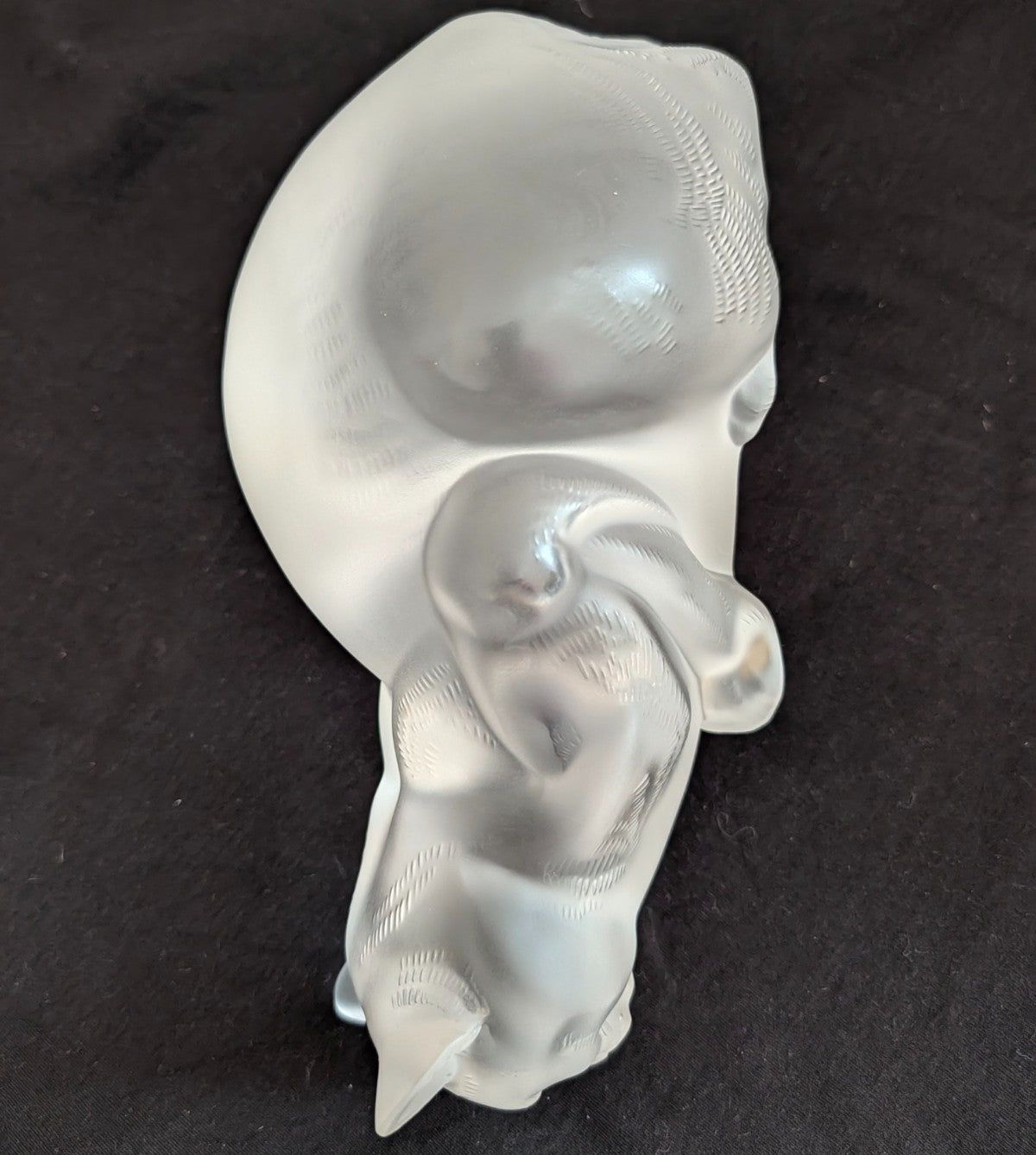 Frosted crystal cat sculpture, side profile with curled tail, textured facial markings