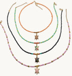 Beaded sea turtle choker necklace with multicolor seed beads and gold-tone turtle pendant