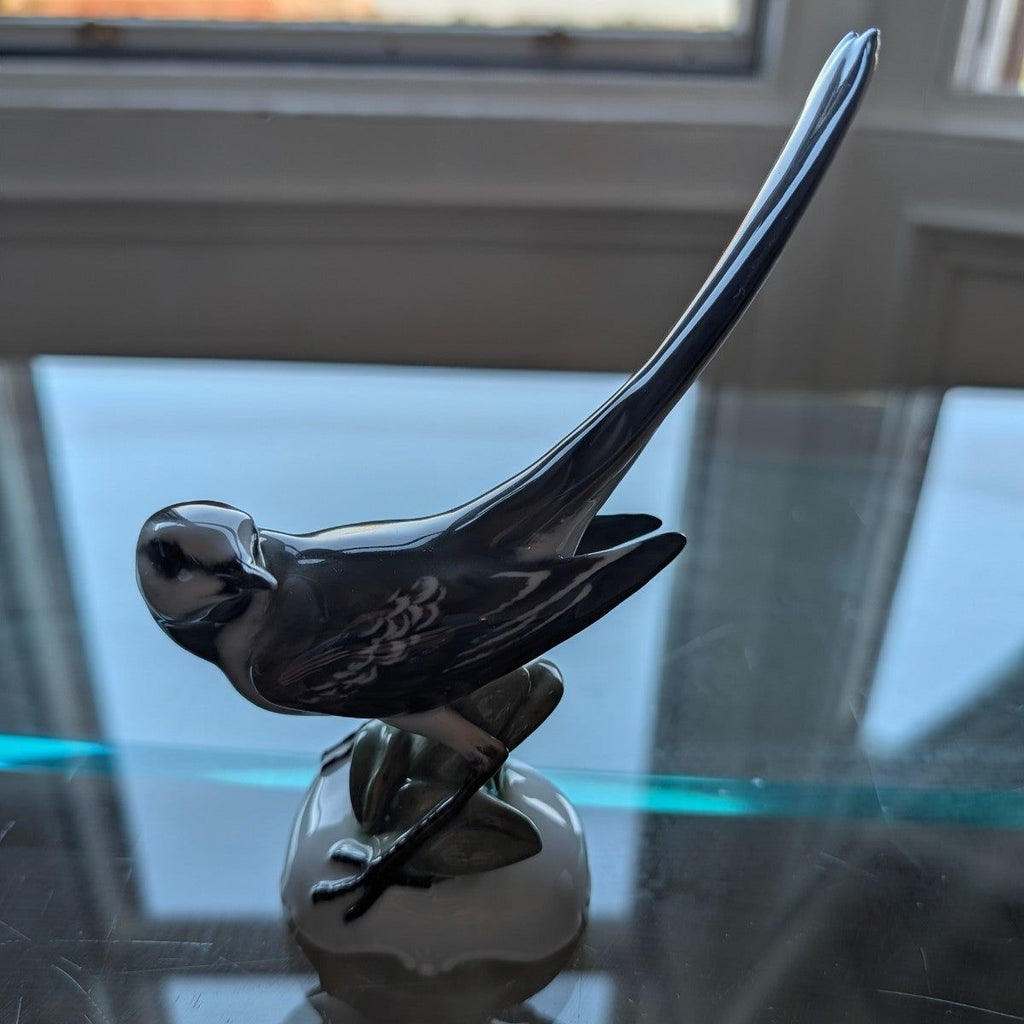 Porcelain pied wagtail figurine in profile, glossy black and white