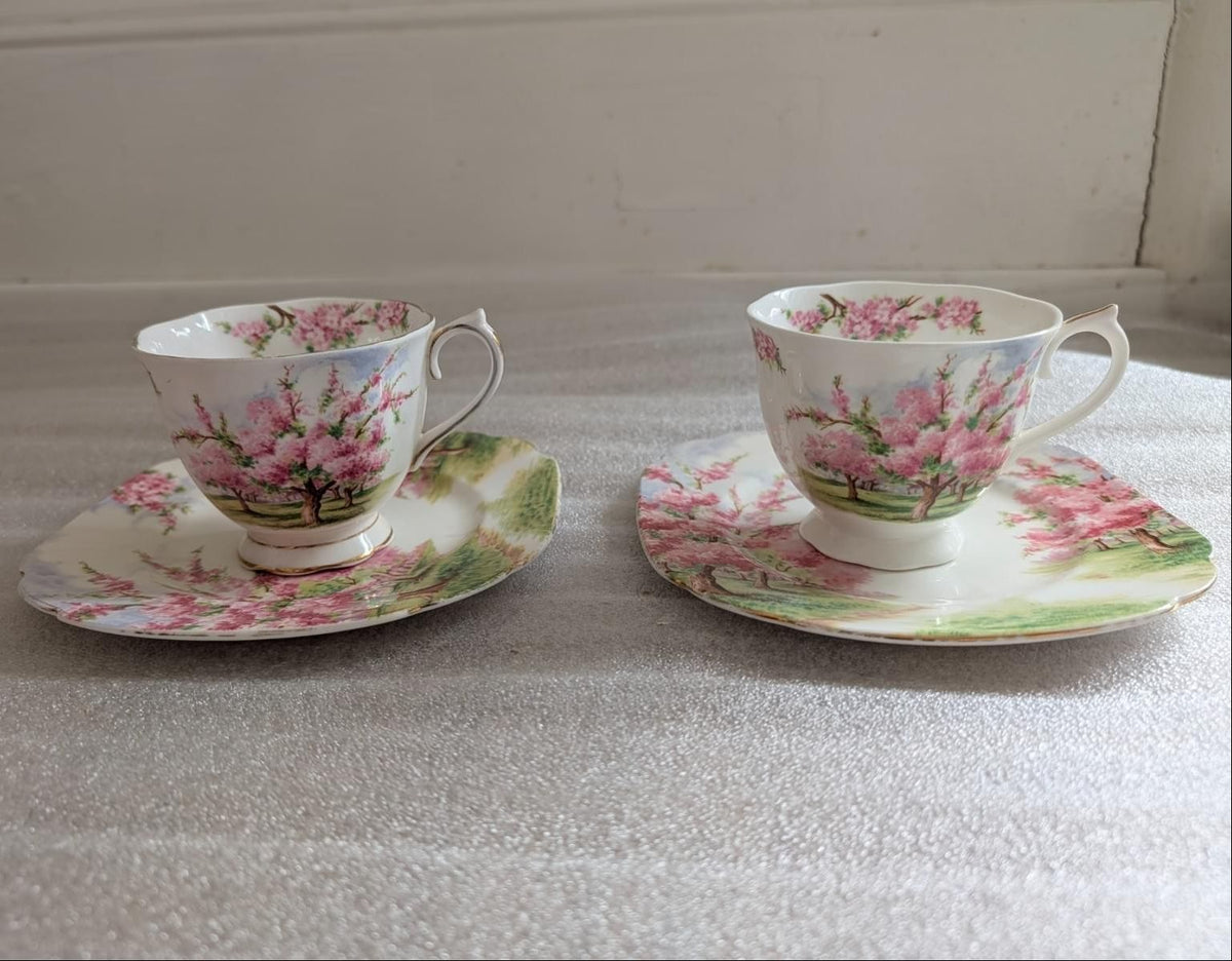 Royal Albert bone china teacups with side plates, pink blossom tree design