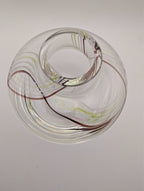 Clear glass bud vase with internal swirl detail around top opening