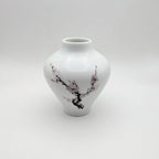 Porcelain bud vase, white with pink cherry blossom and tree-branch design