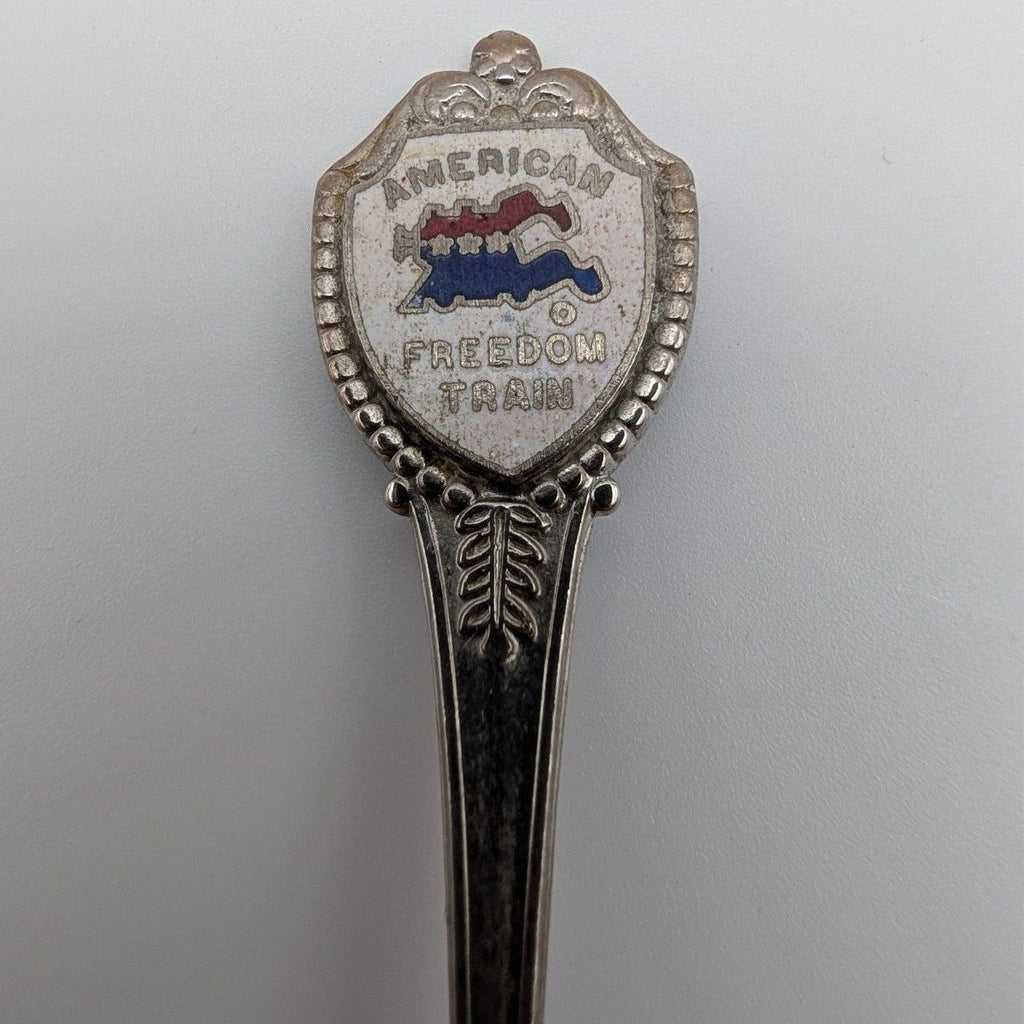 Souvenir collector spoon with top crest reading Freedom Train and beaded border
